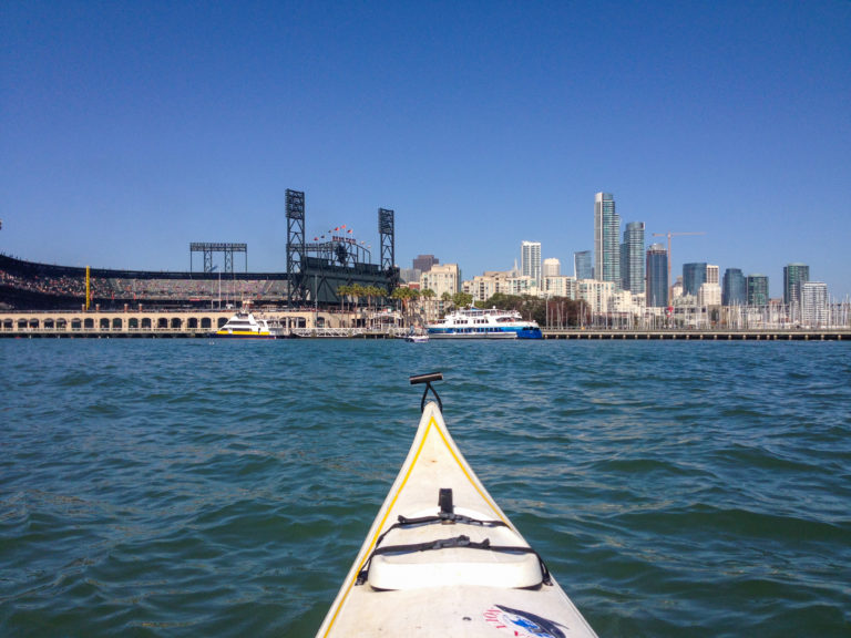 Kayak view of A T & T stadium with San Francisco cityscape in distance